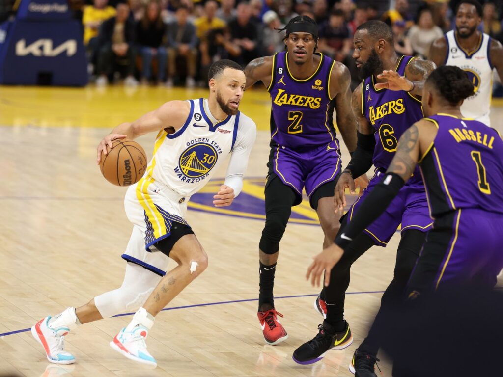 basketball players in uniform on a court